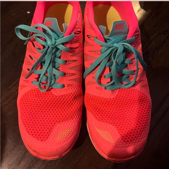 Nike Shoes - Nike Neon pink sneaker with blue laces. US size 9.5. Super comfortable and cute.